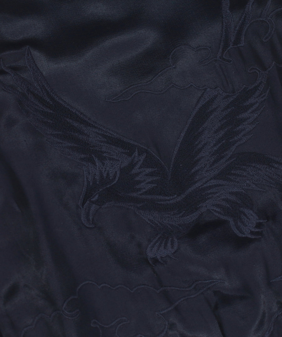 MAHARISHI Tour Jacket B22MH5220 features signature embroidery on a classic souvenir silhouette, blending military style with sustainable design.
