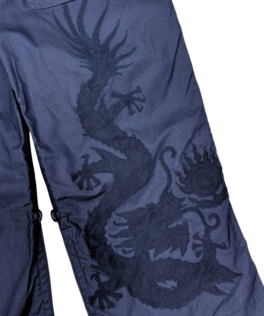 The Maharishi Dragon Boys Snopants 5512 feature bold dragon embroidery, adjustable fit, and durable fabric—perfect for comfort and standout street style.