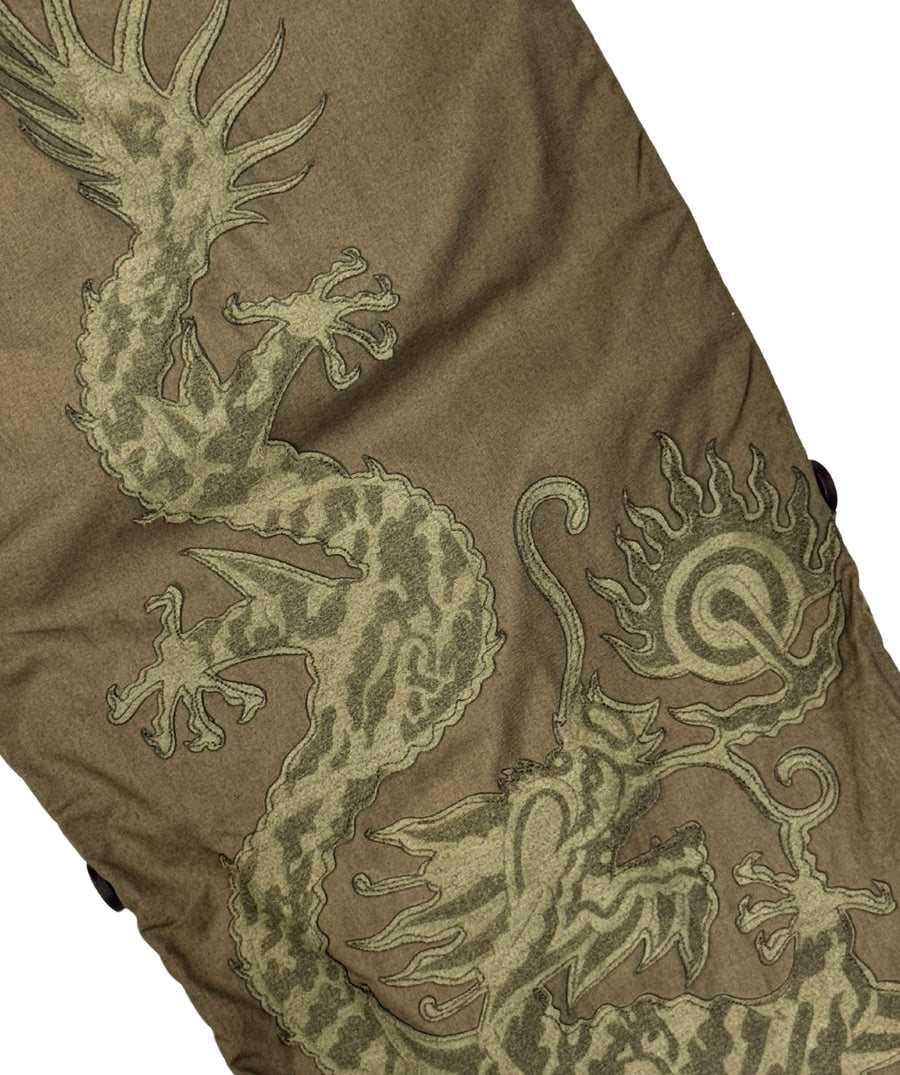 The Maharishi Dragon Boys Snopants 5512 feature bold dragon embroidery, adjustable fit, and durable fabric—perfect for comfort and standout street style.