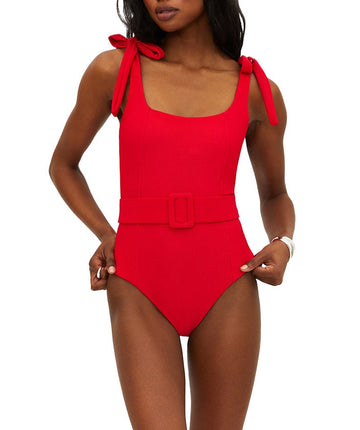 Vibrant red ribbed swimsuit featuring tie shoulder straps, removable cups, shelf bra, and optional belt. Provides a stylish, comfy fit with moderate coverage.