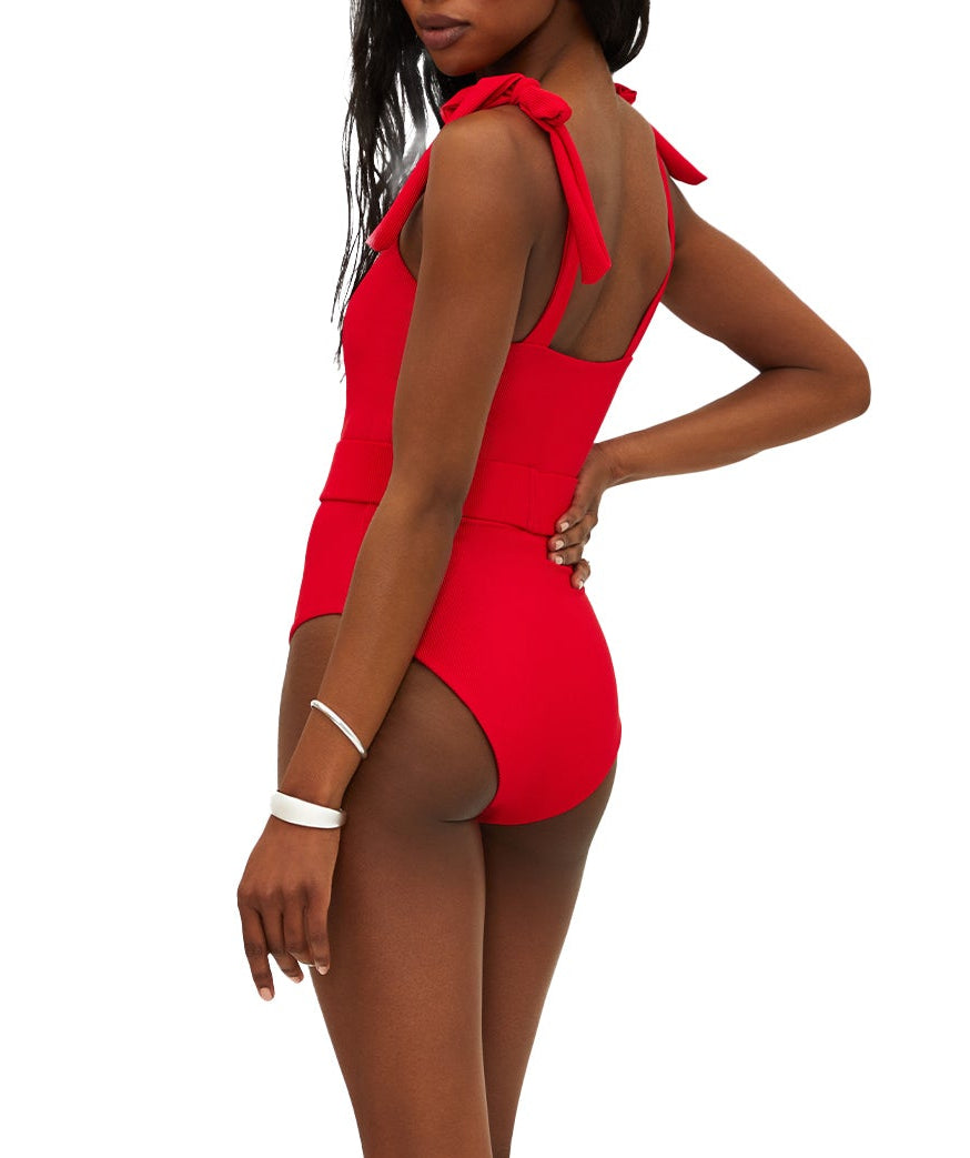 Vibrant red ribbed swimsuit featuring tie shoulder straps, removable cups, shelf bra, and optional belt. Provides a stylish, comfy fit with moderate coverage.