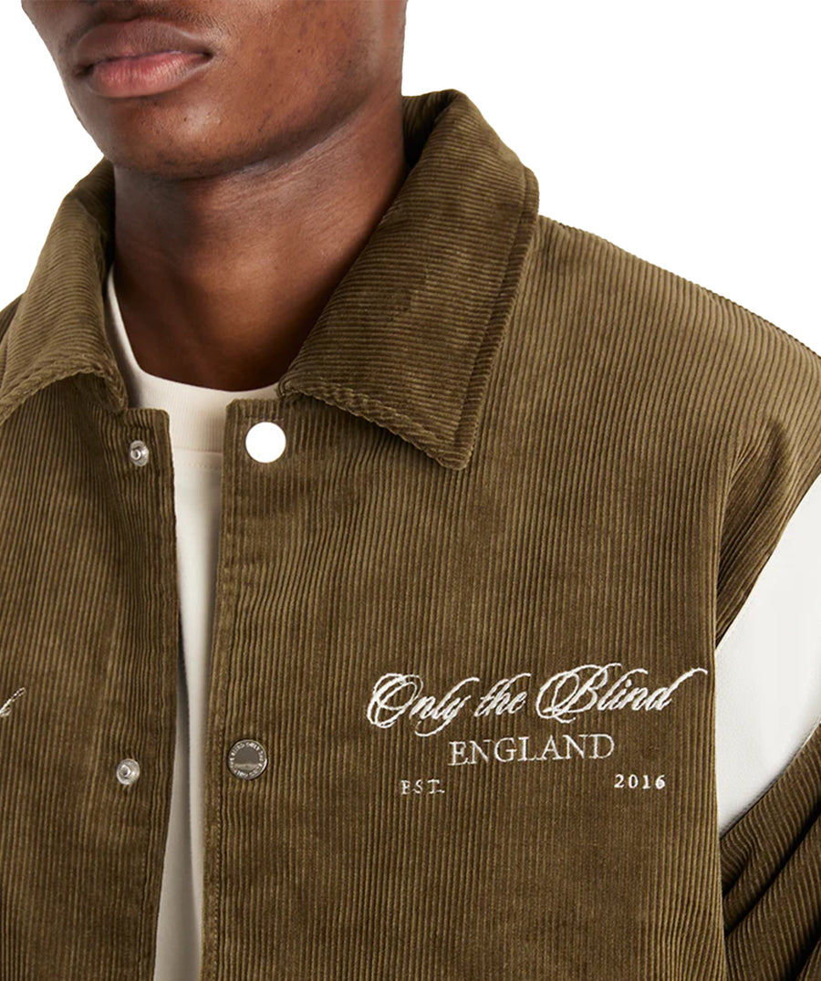 Stand out in the ONLY THE BLIND Blake’s Members Club Varsity Jacket OTBX-O1442 – a bold fusion of luxury design, premium fabrics, and streetwear style.