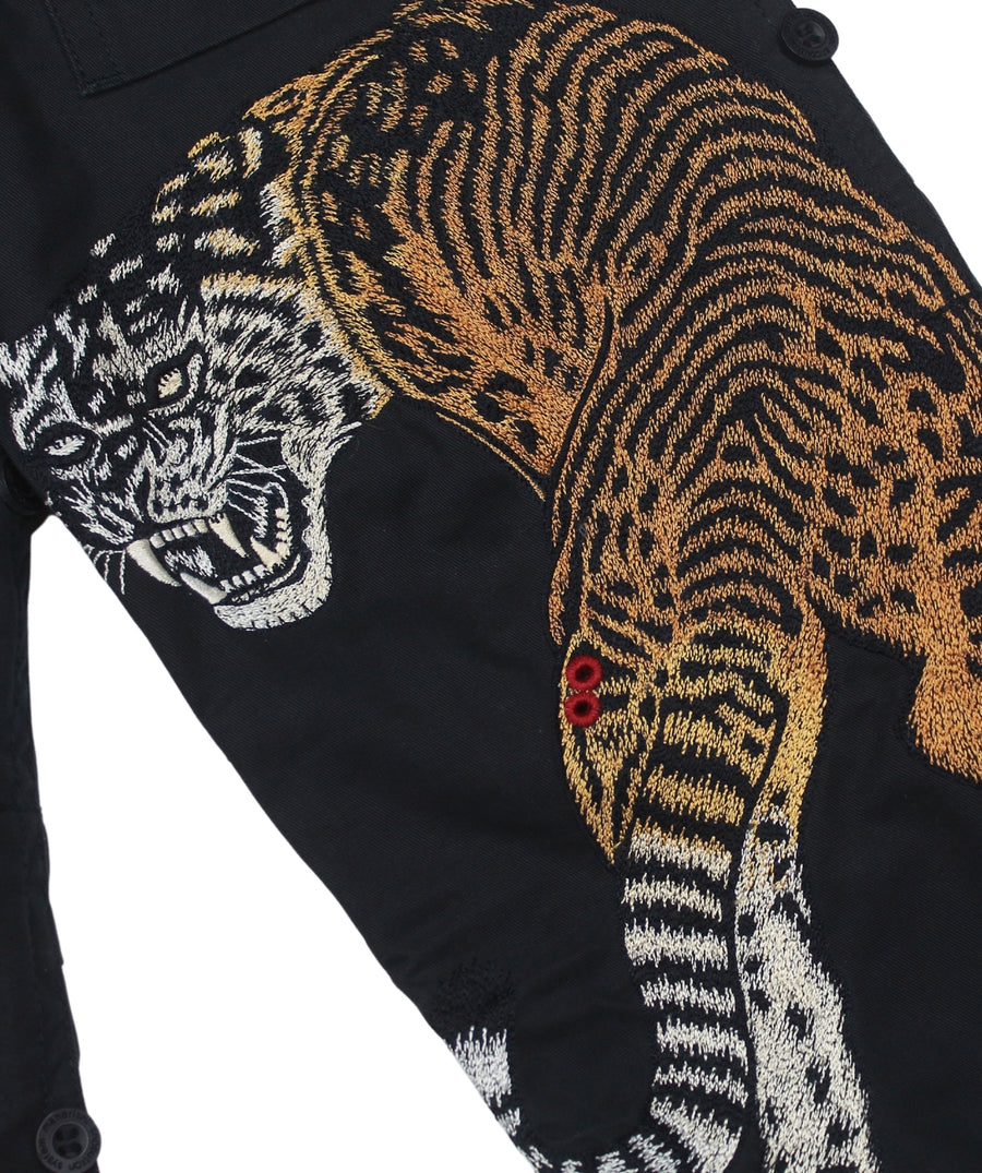 The Maharishi Kid's Tiger Snopants 5508 feature bold tiger embroidery, adjustable waistband, and durable fabric—perfect for stylish, everyday adventure.