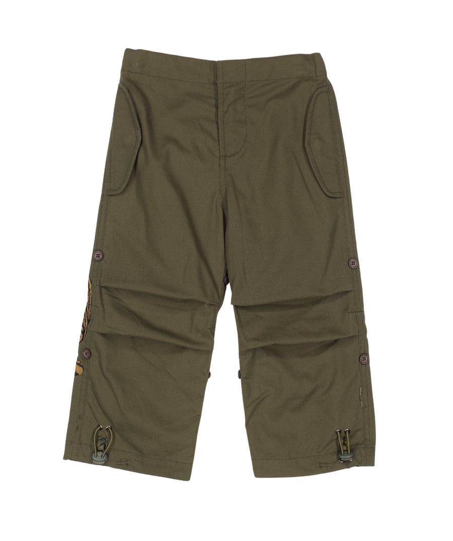 The Maharishi Kid's Tiger Snopants 5508 feature bold tiger embroidery, adjustable waistband, and durable fabric—perfect for stylish, everyday adventure.