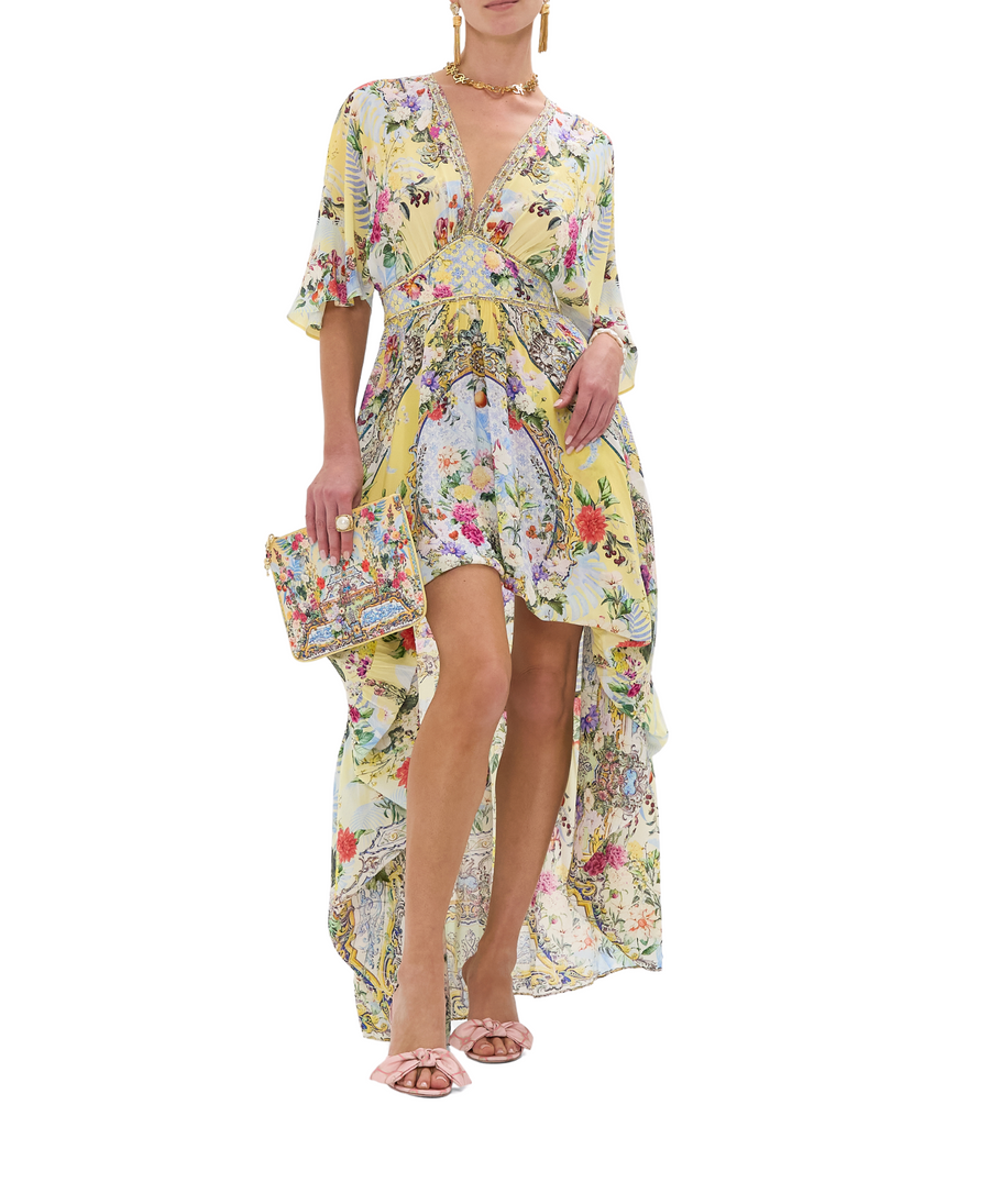 CAMILLA Flor Fantástica Long Dress 00033221 – A luxurious long dress adorned with the bold Flor Fantástica print, detailed embellishments, and a flowing silhouette.