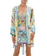 Embrace coastal charm in the CAMILLA Just Coasting Short Kimono Wrap 00035638, featuring oceanic prints, luxe silk, and a relaxed fit for effortless style.