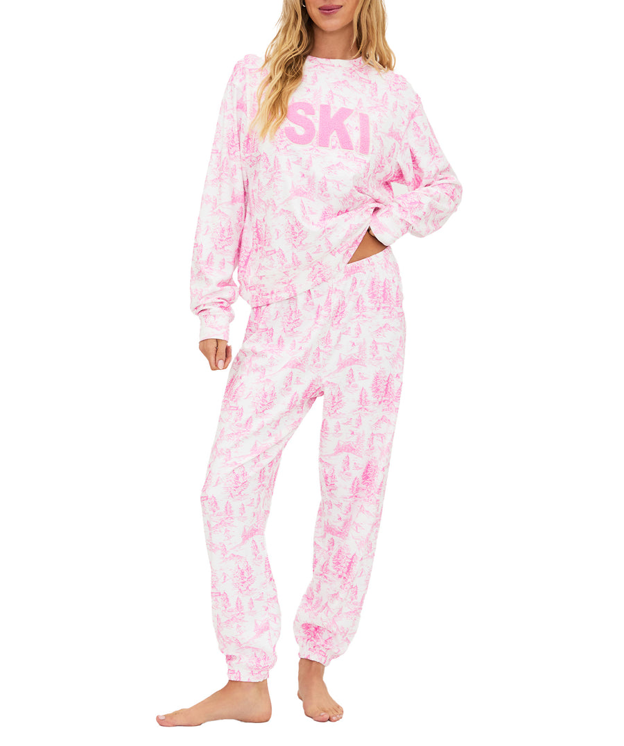 Ultra-soft fleece loungewear set with pink toile print, SKI chenille patch, comfy elastic waist, pockets, and relaxed fit for cozy cold-weather wear.
