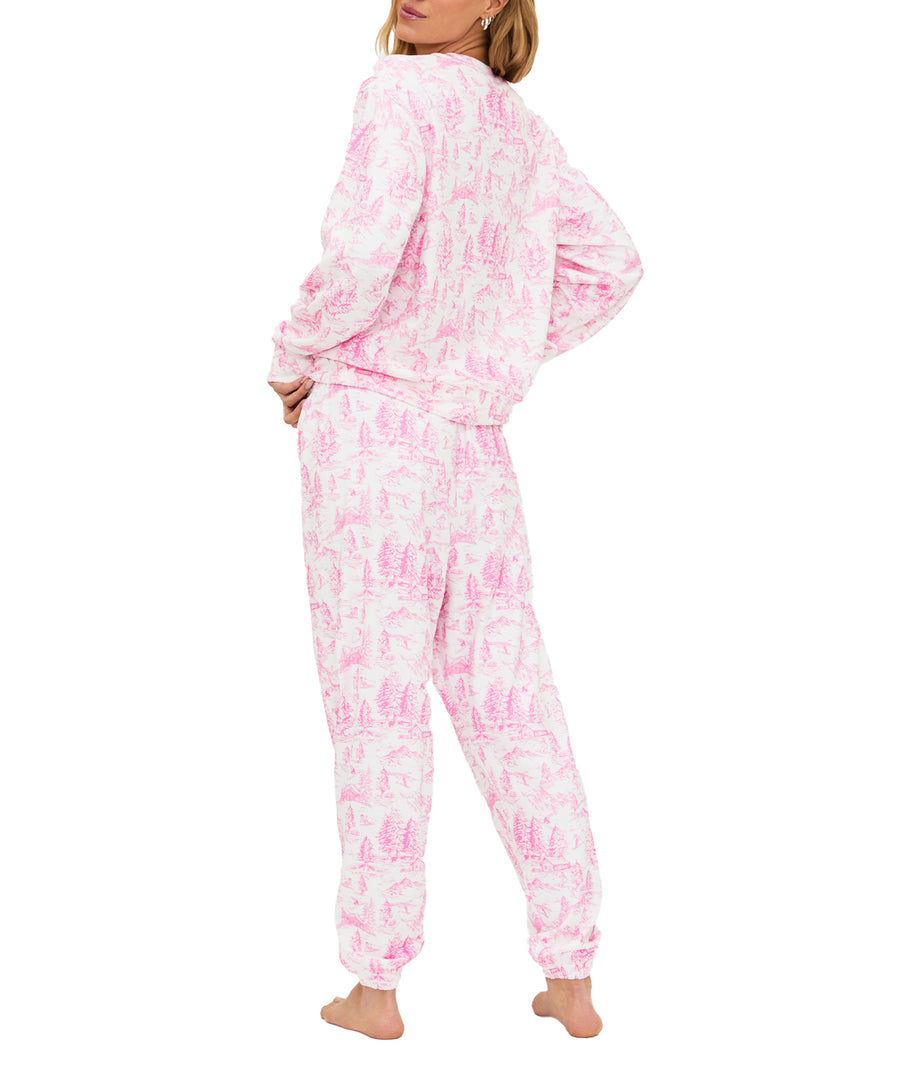 Ultra-soft fleece loungewear set with pink toile print, SKI chenille patch, comfy elastic waist, pockets, and relaxed fit for cozy cold-weather wear.