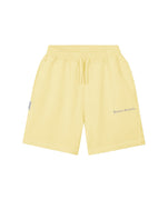 Yellow shorts with a brand logo on a white background