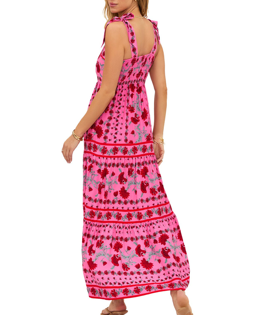Elegant floral maxi featuring a square neckline, ruffled tie straps, pockets, tiered skirt, and a smocked back for the perfect fit. 100% rayon.