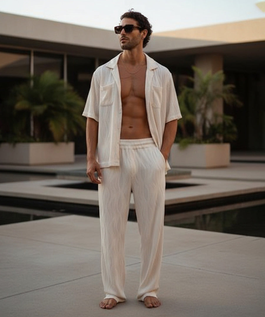 A comfy wave-textured matching set featuring a relaxed camp-collar shirt and elastic-waist pants. Ideal for warm weather, vacations, lounging, or everyday resort vibes.