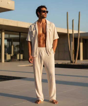 A comfy wave-textured matching set featuring a relaxed camp-collar shirt and elastic-waist pants. Ideal for warm weather, vacations, lounging, or everyday resort vibes.