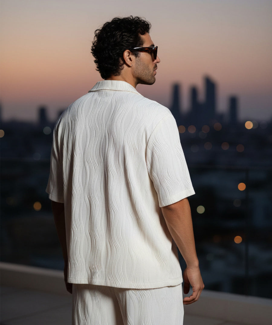 A comfy wave-textured matching set featuring a relaxed camp-collar shirt and elastic-waist pants. Ideal for warm weather, vacations, lounging, or everyday resort vibes.