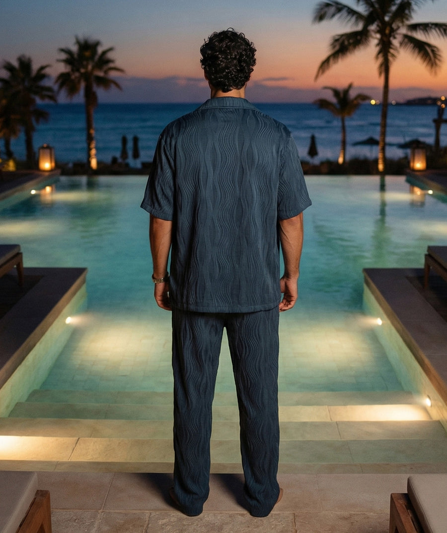 Soft, breathable wave-textured set with a camp-collar shirt, pockets, and comfy elastic pants. Ideal for vacations, resort looks, and relaxed everyday outfits.